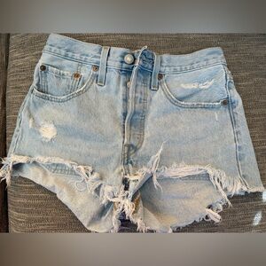 Levi’s Distressed Light Blue and Black Denim Shorts